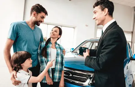 Family at Dealer | CarMoney.co.uk